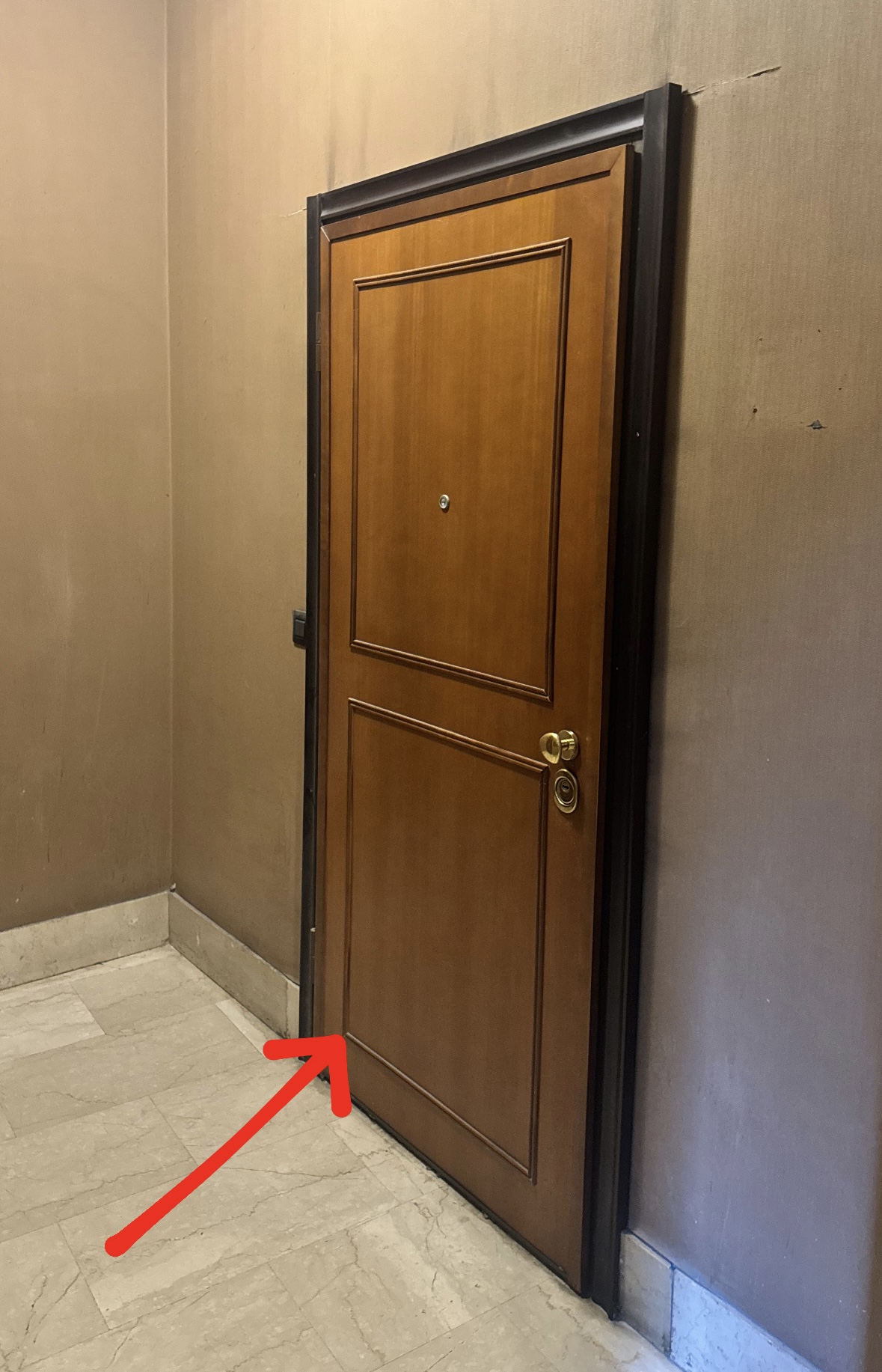 Door to the left of the elevators (keybox on the right)